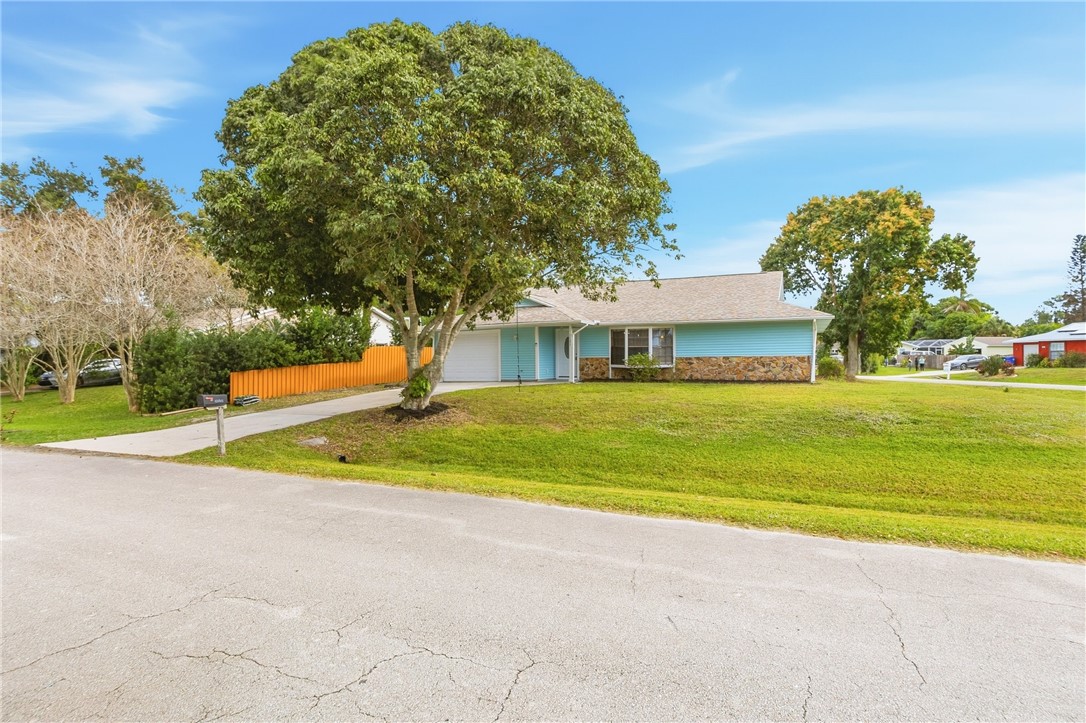 1121 Clearmont Street Sebastian, FL 32958 - Photo 4 of 31 a view of swimming pool and trees in the background