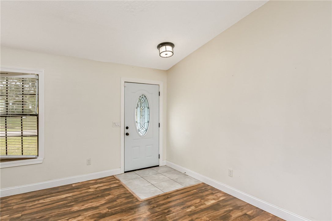 1121 Clearmont Street Sebastian, FL 32958 - Photo 6 of 31 a view of a livingroom with wooden floor and a window