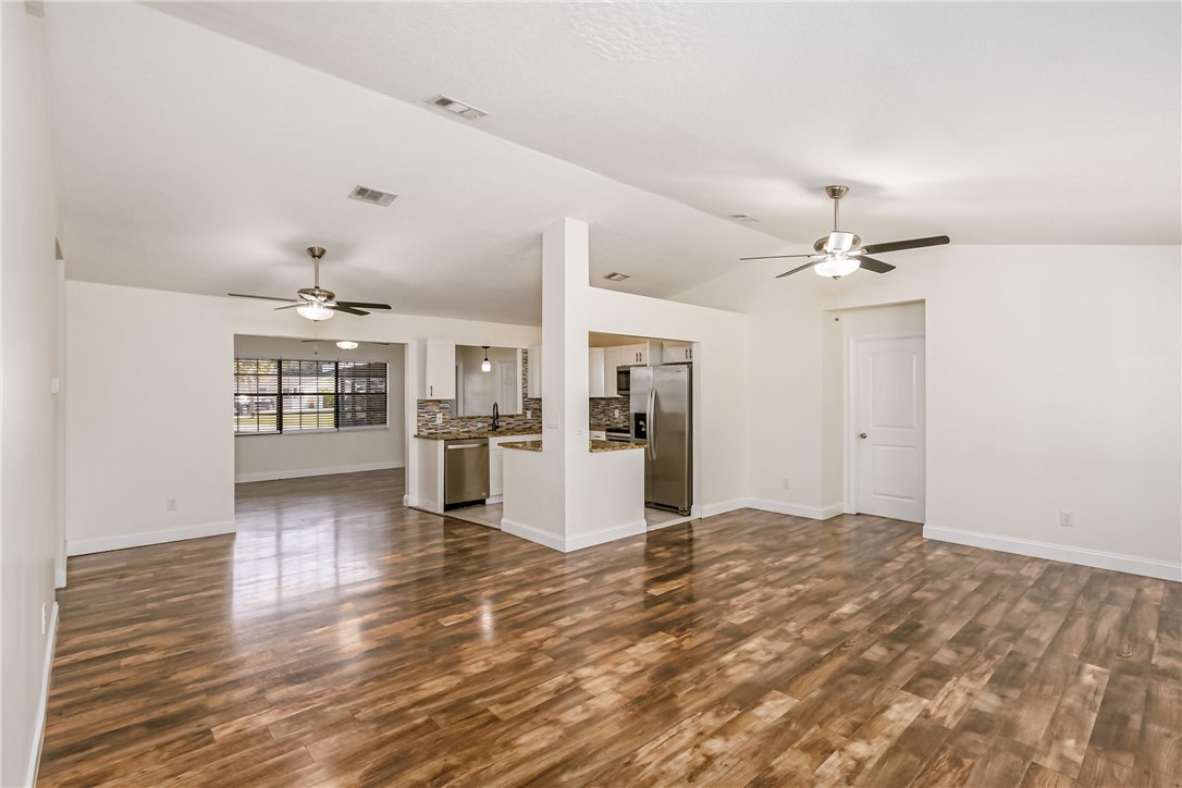 1121 Clearmont Street Sebastian, FL 32958 - Photo 10 of 31 a view interior of a house and empty room with wooden floor