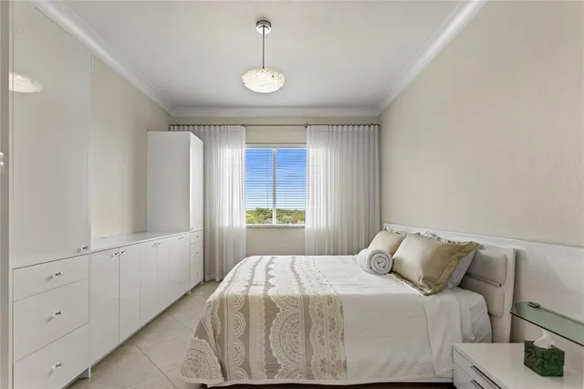 a bedroom with a bed and a cabinets