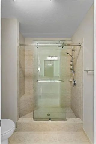 a bathroom with a shower and a sink
