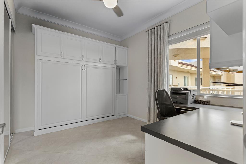 3500 Oaks Clubhouse Drive, Unit 505 Pompano Beach, FL 33069 - Photo 31 of 33 a living room with furniture and large windows