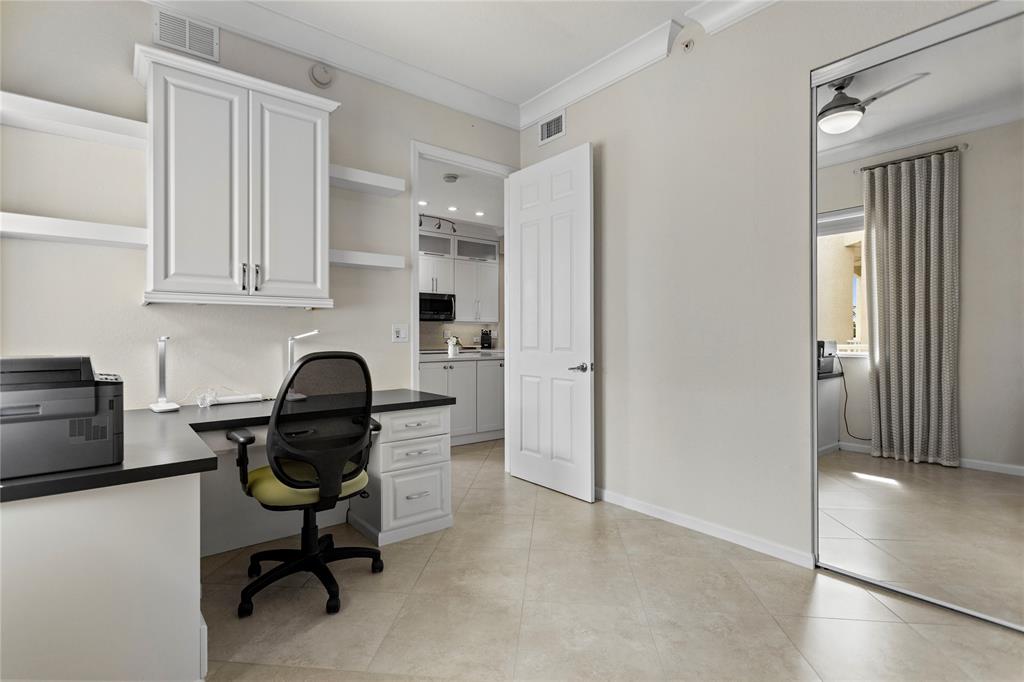3500 Oaks Clubhouse Drive, Unit 505 Pompano Beach, FL 33069 - Photo 33 of 33 a view of a workspace with furniture and a window