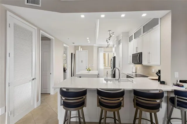 a kitchen with a sink a stove and refrigerator