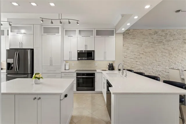 a view of kitchen island a sink and living room