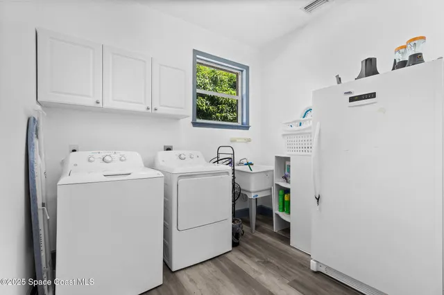 a view of a house with backyard porch and sitting area