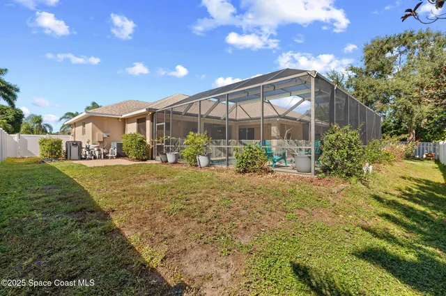 an aerial view of a house with a ocean view