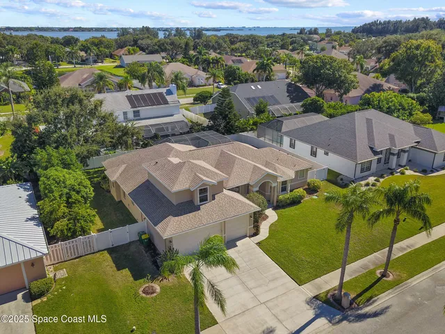 an aerial view of a house with a garden