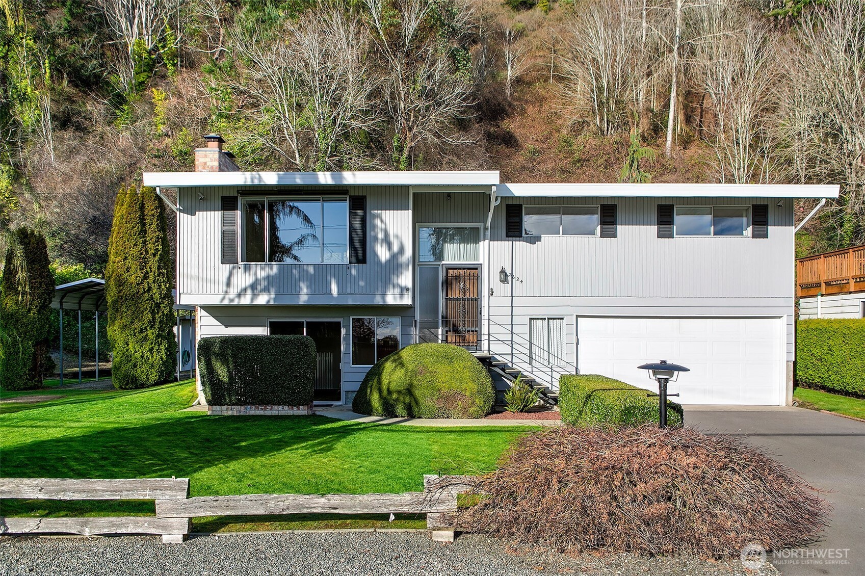 2624 Southwest 172nd Street Burien, WA 98166 - Photo 28 of 30 a view of a house with a small yard plants and a large tree