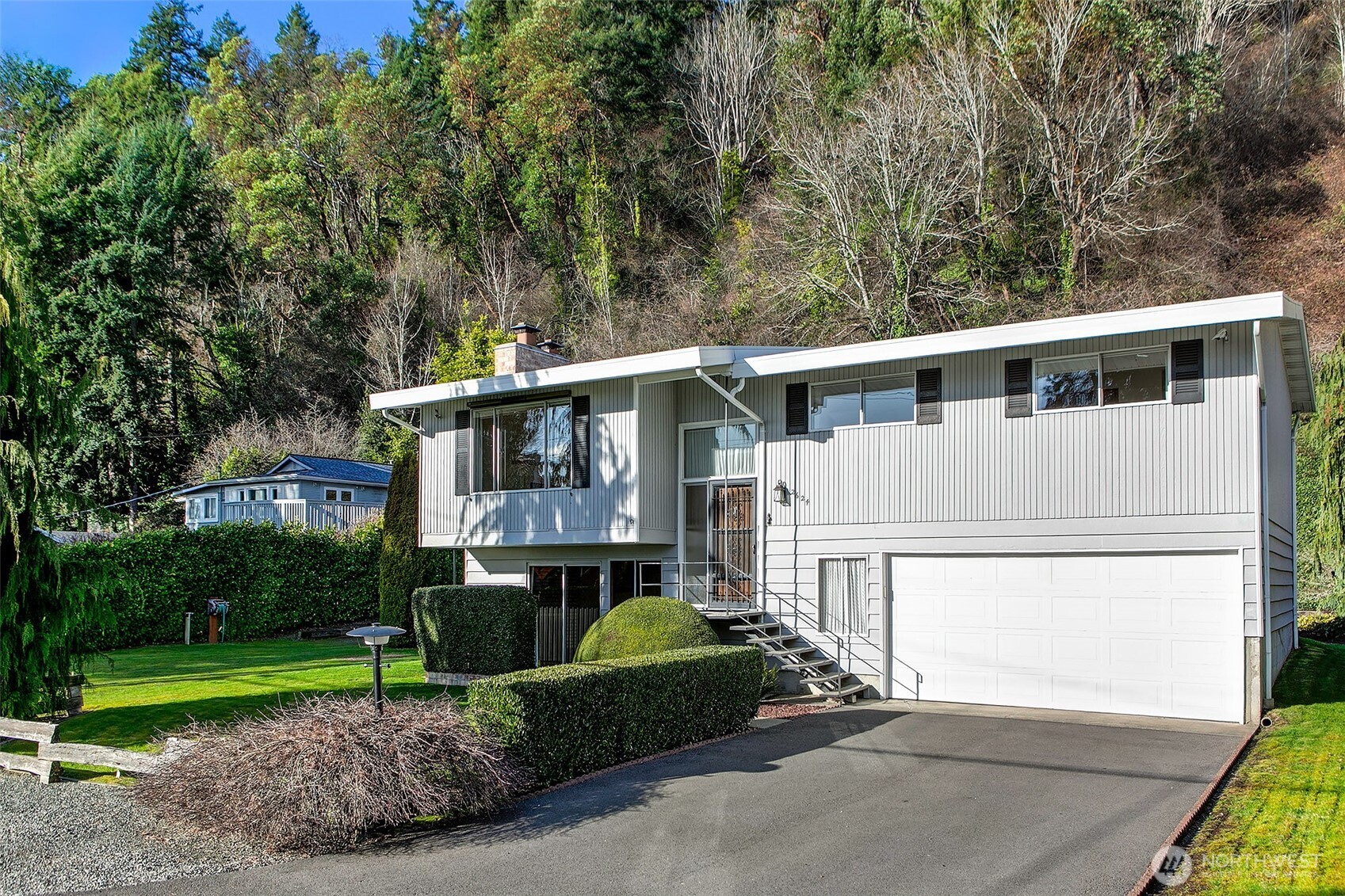 2624 Southwest 172nd Street Burien, WA 98166 - Photo 3 of 30 a front view of a house with a yard and trees