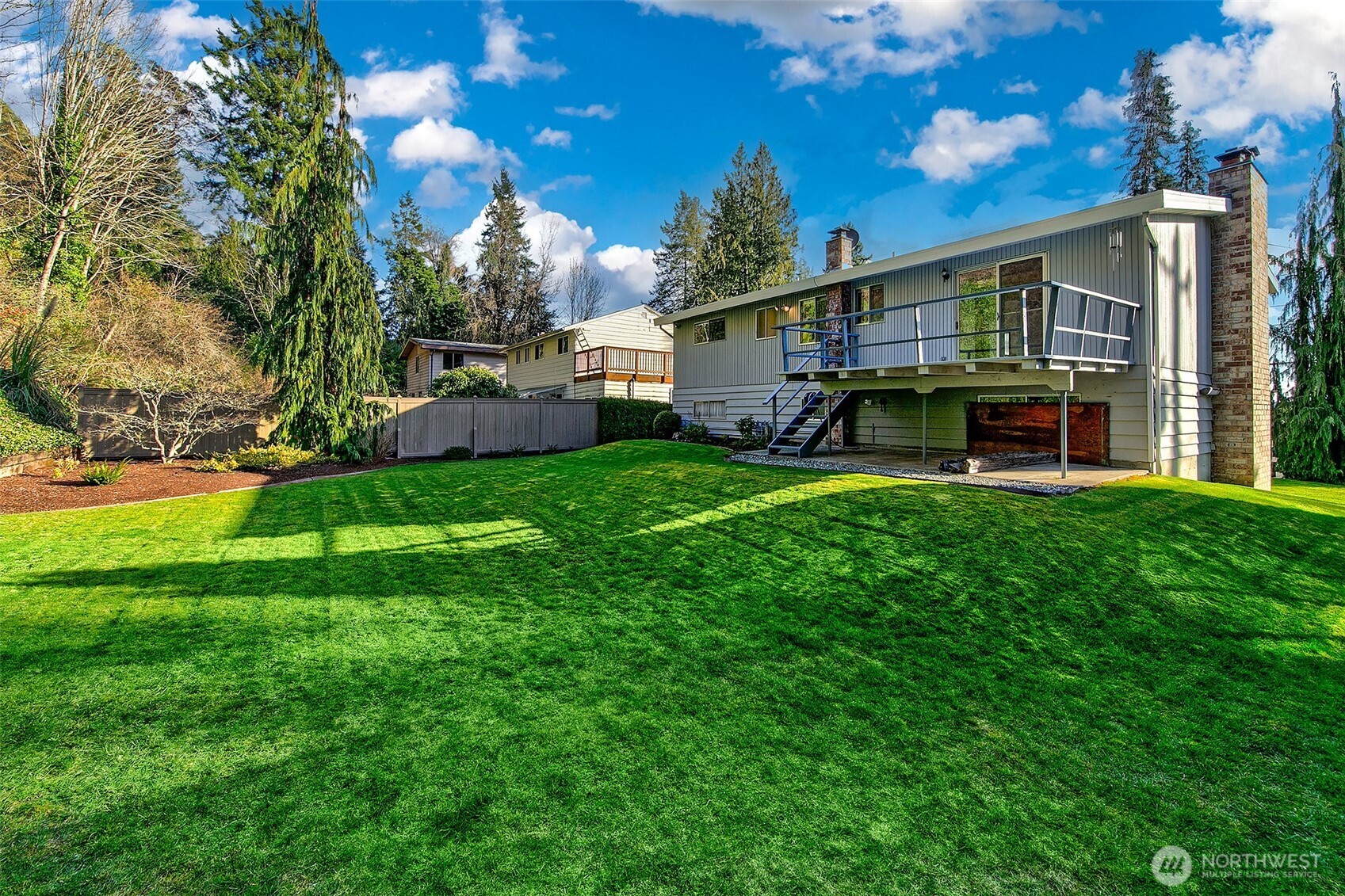 2624 Southwest 172nd Street Burien, WA 98166 - Photo 5 of 30 a view of a house with a big yard and a large tree
