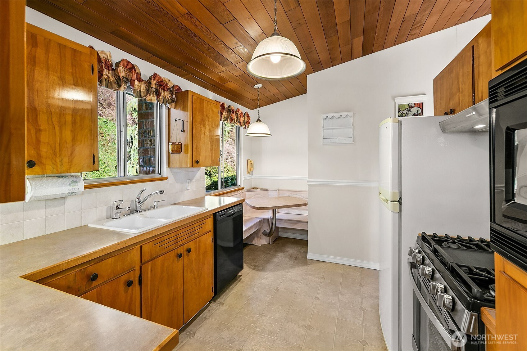 2624 Southwest 172nd Street Burien, WA 98166 - Photo 8 of 30 a kitchen with a sink appliances and cabinets