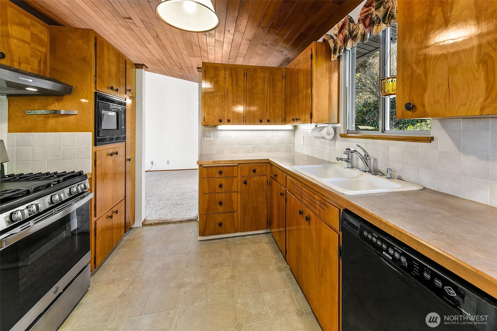 2624 Southwest 172nd Street Burien, WA 98166 - Photo 9 of 30 a kitchen with a sink stove and cabinets