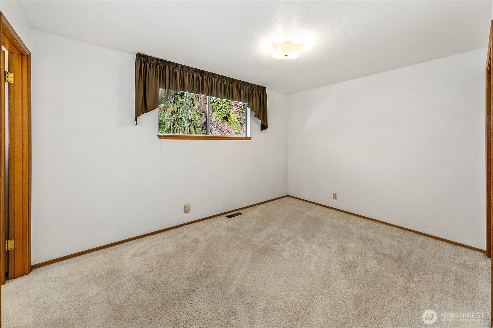 2624 Southwest 172nd Street Burien, WA 98166 - Photo 10 of 30 an empty room with wall painting and refrigerator