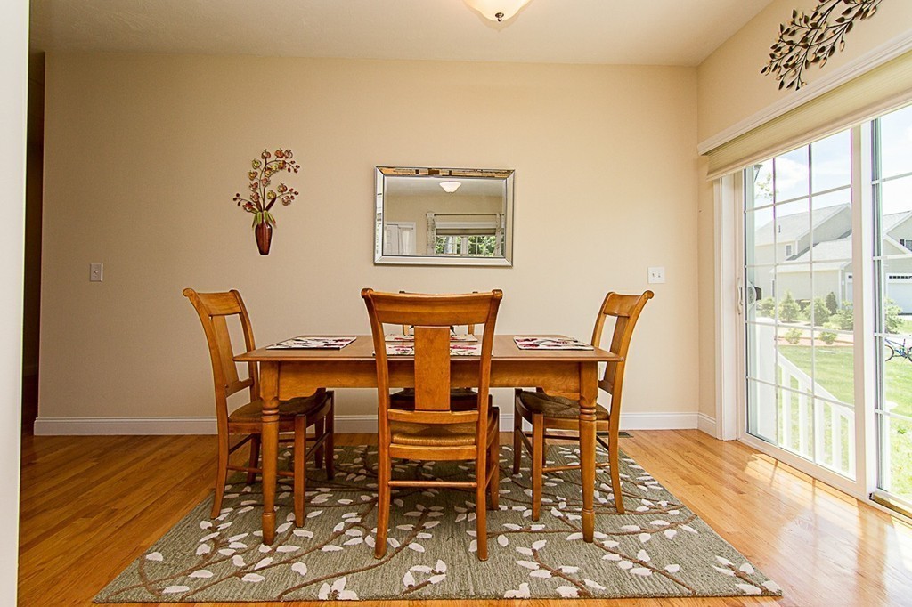 19 Geordan Avenue Bellingham, MA 02019 - Photo 11 of 22 a view of a dining room with furniture and wooden floor