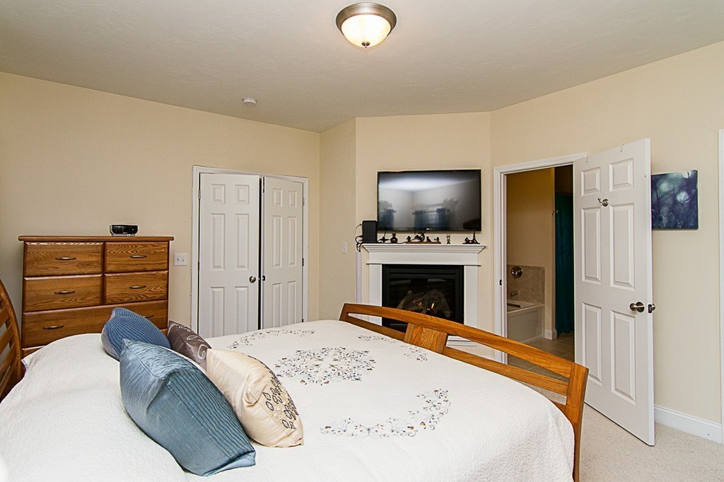 19 Geordan Avenue Bellingham, MA 02019 - Photo 14 of 22 a bed room with a bed and a television