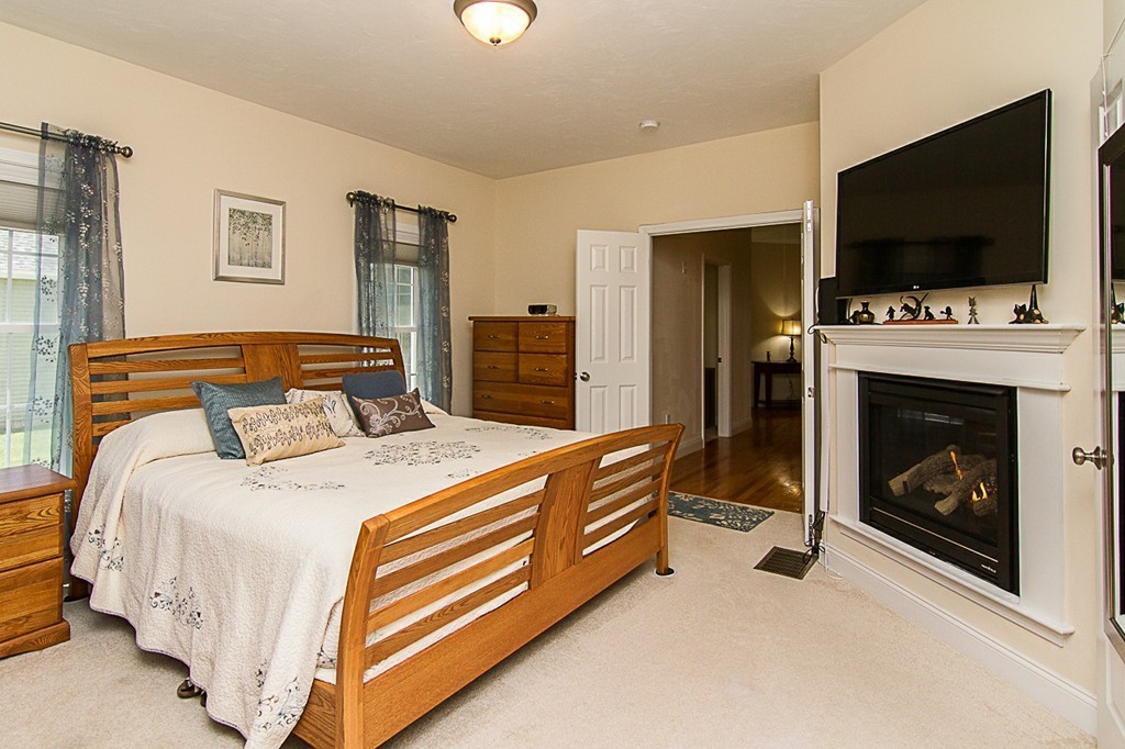 19 Geordan Avenue Bellingham, MA 02019 - Photo 16 of 22 a bedroom with a bed and a flat screen tv