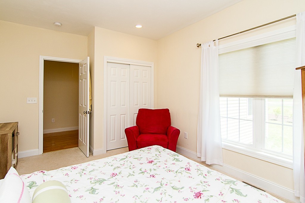 19 Geordan Avenue Bellingham, MA 02019 - Photo 18 of 22 a bedroom with a bed and a window