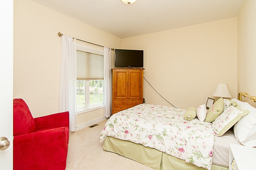 19 Geordan Avenue Bellingham, MA 02019 - Photo 19 of 22 a bedroom with a bed and a flat screen tv