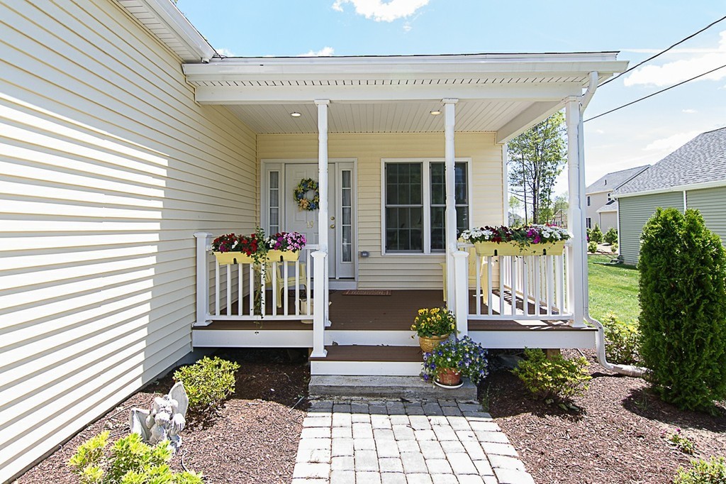 19 Geordan Avenue Bellingham, MA 02019 - Photo 4 of 22 a front view of a house with a garden