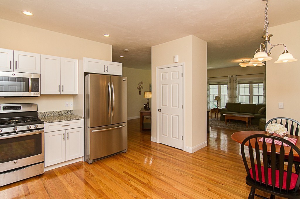 19 Geordan Avenue Bellingham, MA 02019 - Photo 5 of 22 a kitchen with stainless steel appliances granite countertop a refrigerator stove and oven