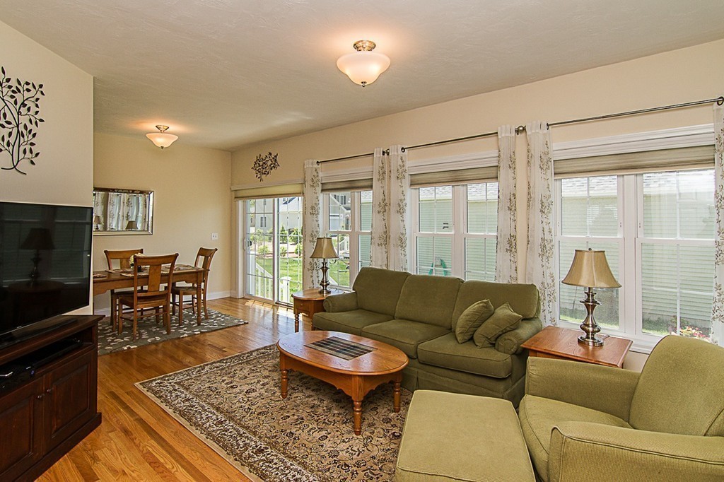 19 Geordan Avenue Bellingham, MA 02019 - Photo 8 of 22 a living room with furniture and a flat screen tv