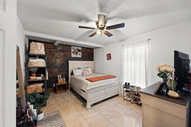 a bathroom with a sink vanity mirror and toilet