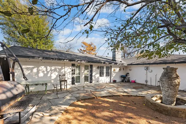 a view of a park with large trees