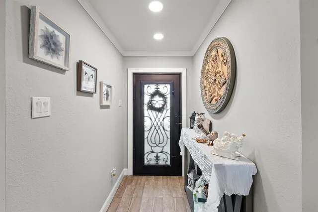 a view of a hallway with elevator with mirror
