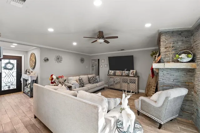 a living room with furniture and a fireplace