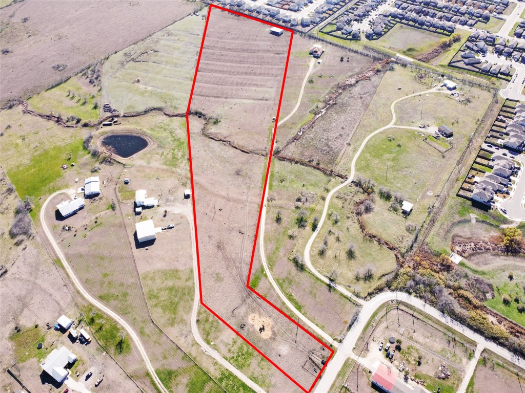 12321 Johnson Road Manor, TX 78653 - Photo 17 of 32 an aerial view of a balcony with wooden floor