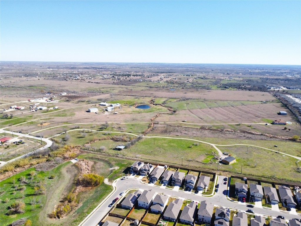 12321 Johnson Road Manor, TX 78653 - Photo 8 of 32 an aerial view of residential houses with outdoor space