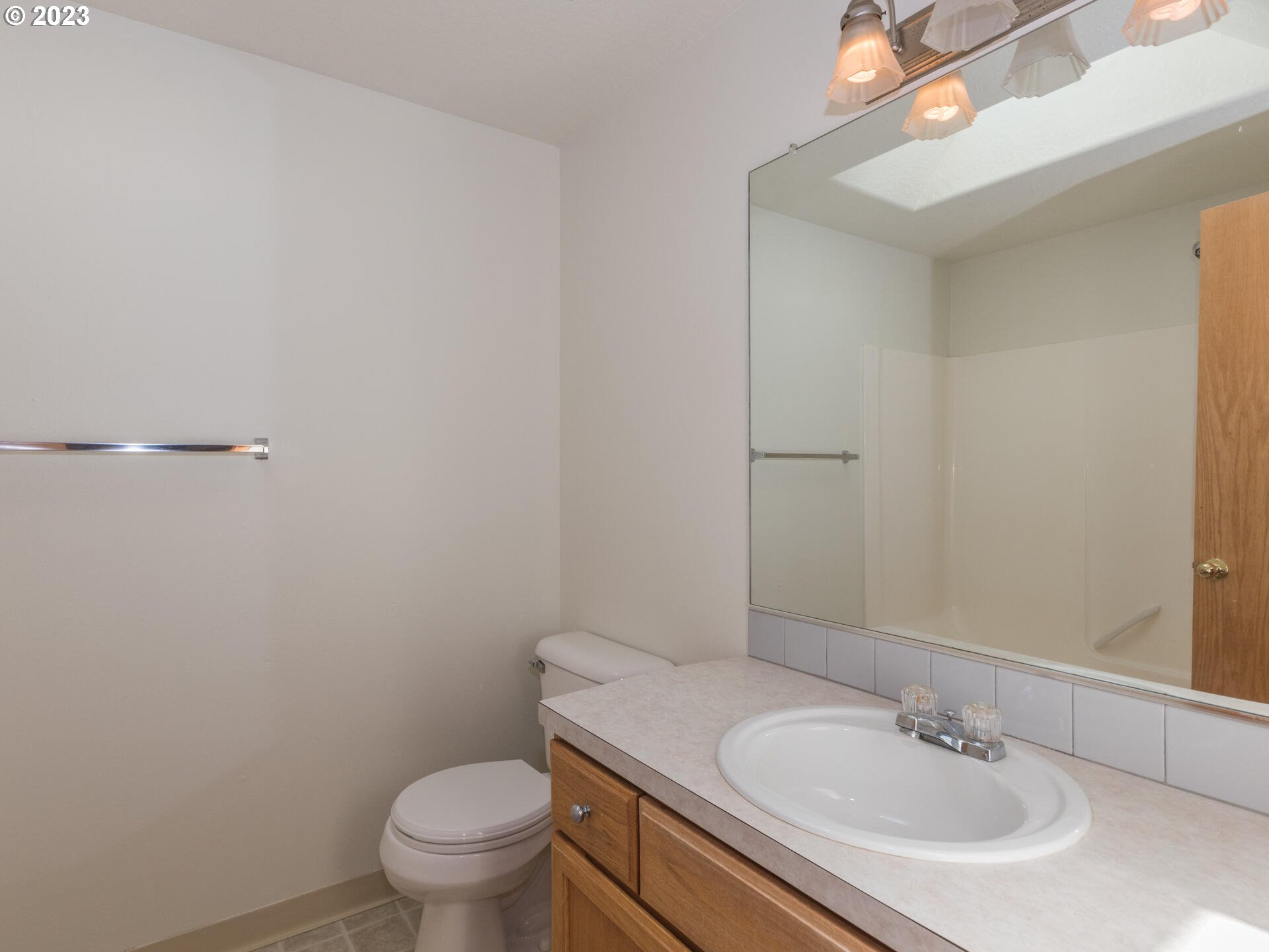 1058 Southwest Ivory Loop Gresham, OR 97080 - Photo 23 of 31 a bathroom with a sink toilet and a mirror