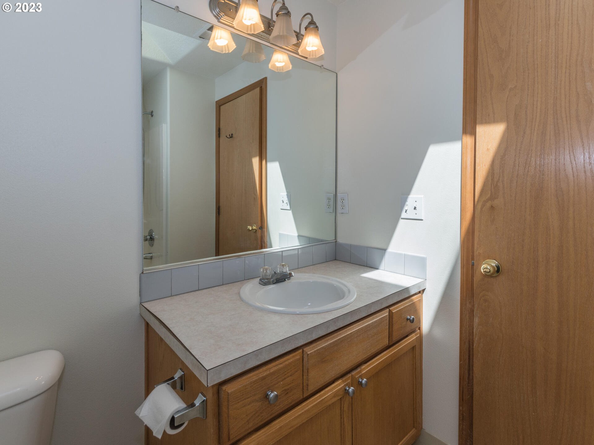1058 Southwest Ivory Loop Gresham, OR 97080 - Photo 25 of 31 a bathroom with a sink vanity and a mirror