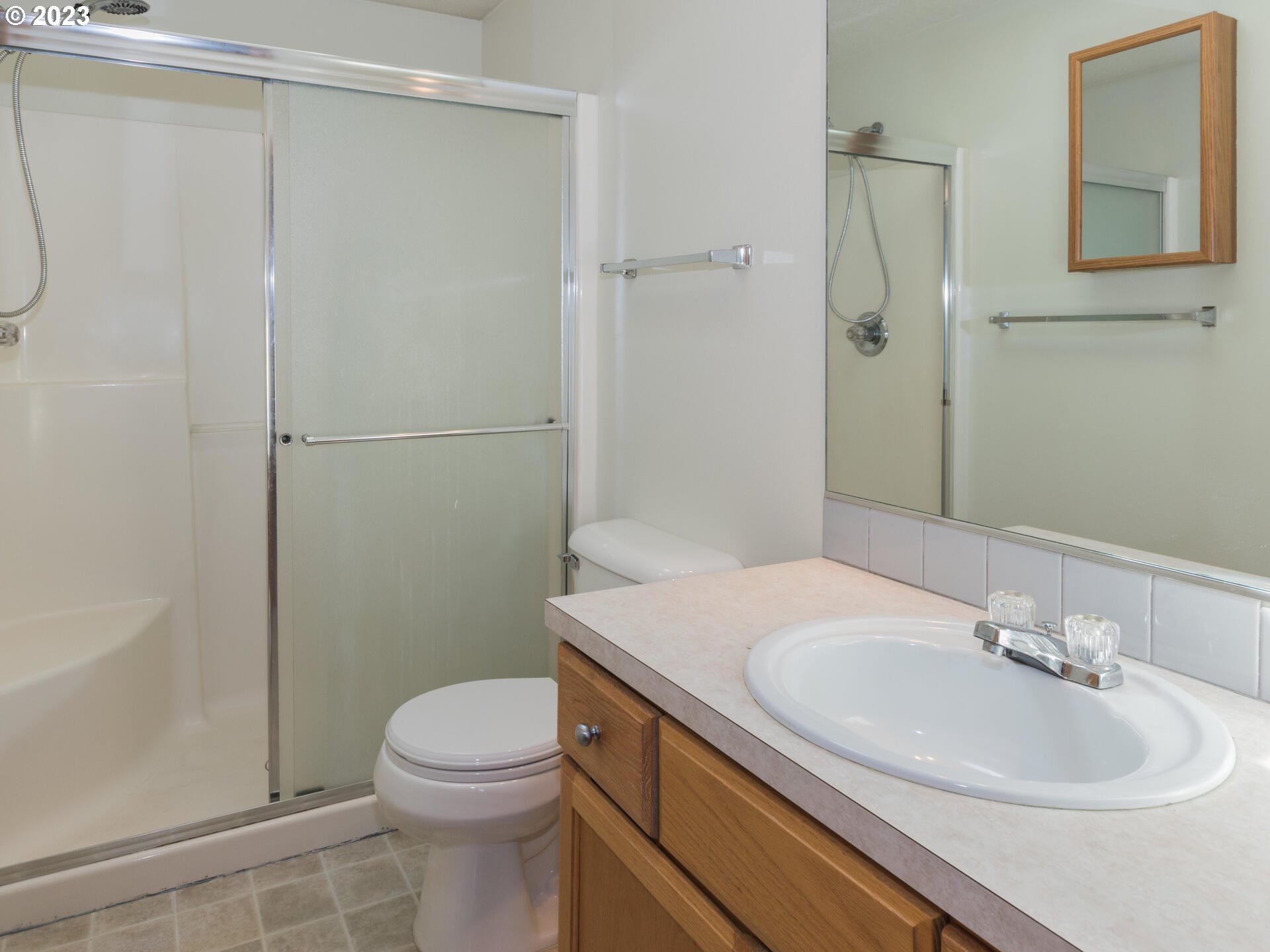 1058 Southwest Ivory Loop Gresham, OR 97080 - Photo 26 of 31 a bathroom with a sink a toilet and shower