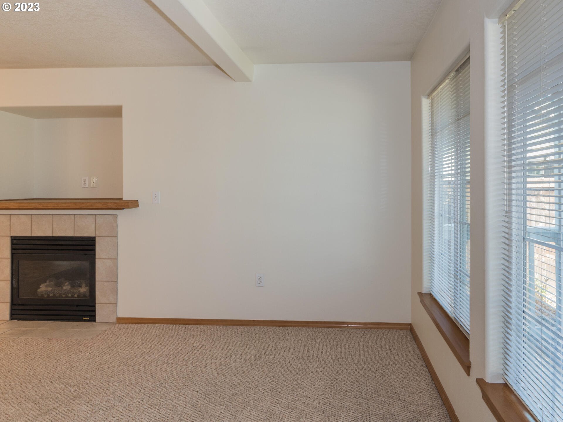 1058 Southwest Ivory Loop Gresham, OR 97080 - Photo 6 of 31 a view of empty room with a fireplace