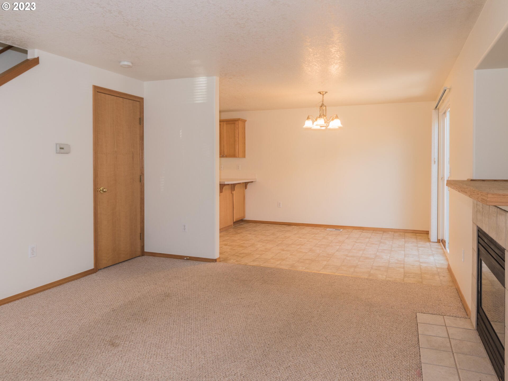 1058 Southwest Ivory Loop Gresham, OR 97080 - Photo 9 of 31 a view of an empty room with a fireplace