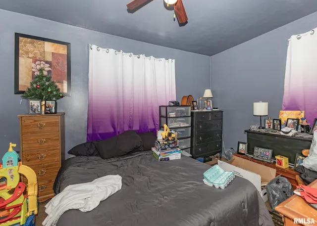 a bed room with a bed and a window