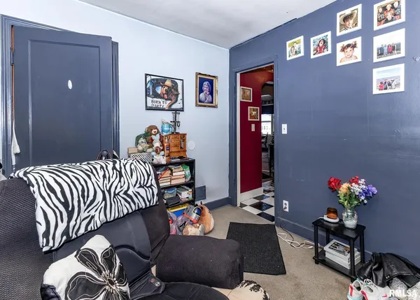 a bedroom with a bed and a couch