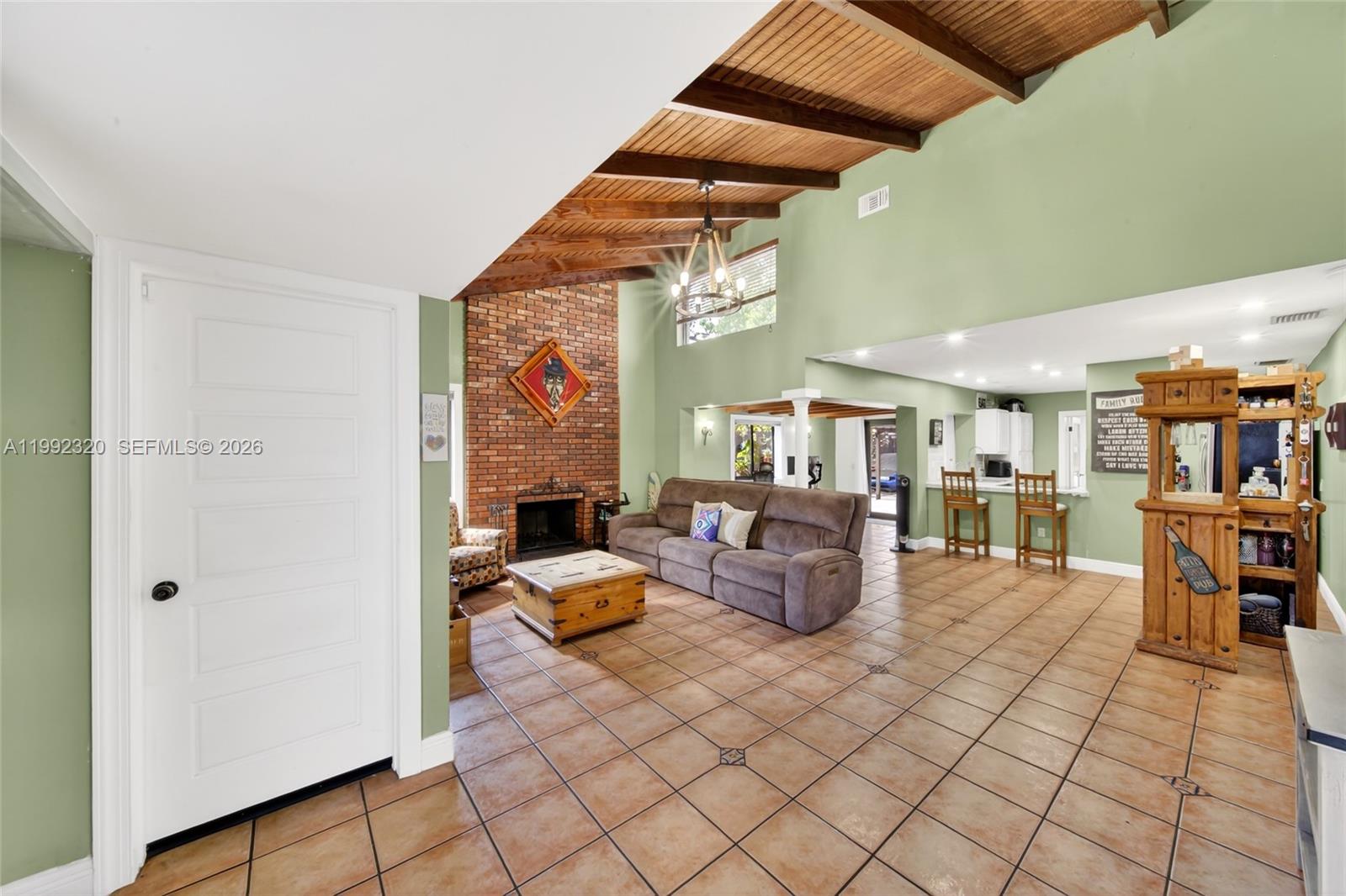10861 Southwest 132nd Cir Court Miami, FL 33186 - Photo 12 of 42 a living room with fireplace furniture and a window