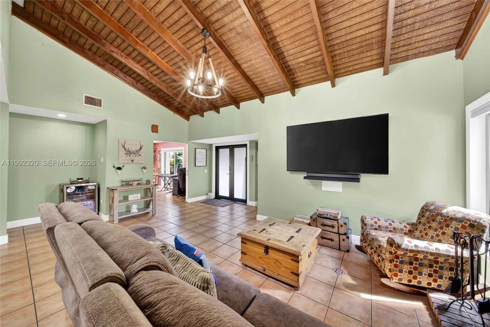 10861 Southwest 132nd Cir Court Miami, FL 33186 - Photo 15 of 42 a living room with furniture and a flat screen tv