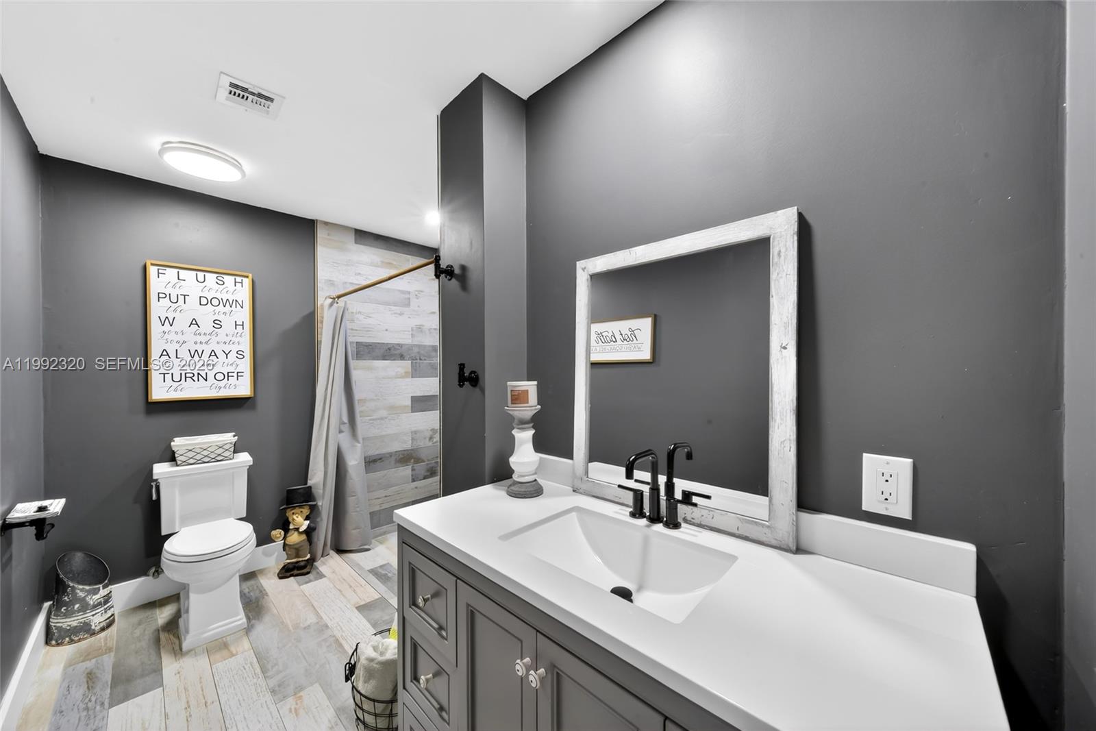 10861 Southwest 132nd Cir Court Miami, FL 33186 - Photo 18 of 42 a bathroom with a sink toilet and shower