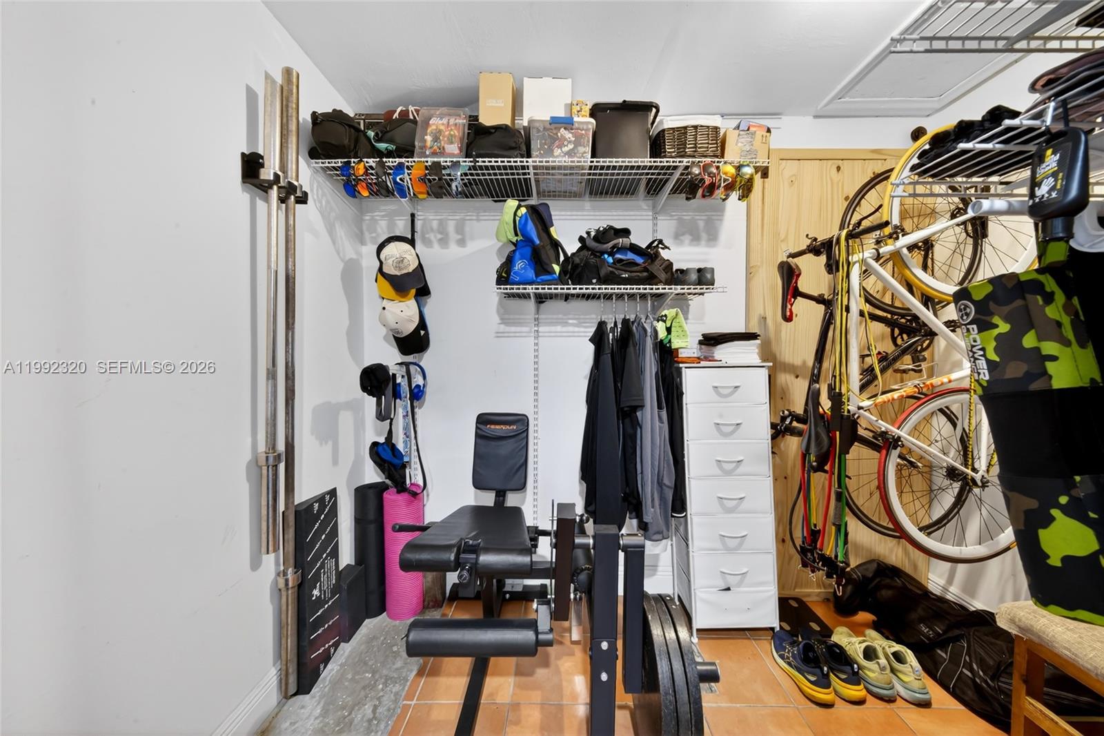 10861 Southwest 132nd Cir Court Miami, FL 33186 - Photo 21 of 42 a view of walk in closet with clothes and shoes
