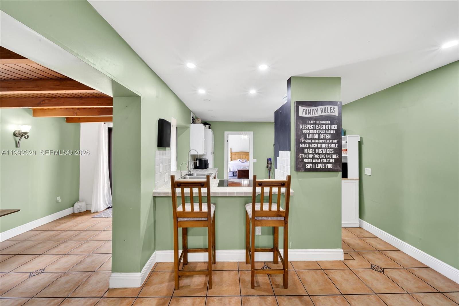 10861 Southwest 132nd Cir Court Miami, FL 33186 - Photo 22 of 42 a view of a dining room with furniture and window