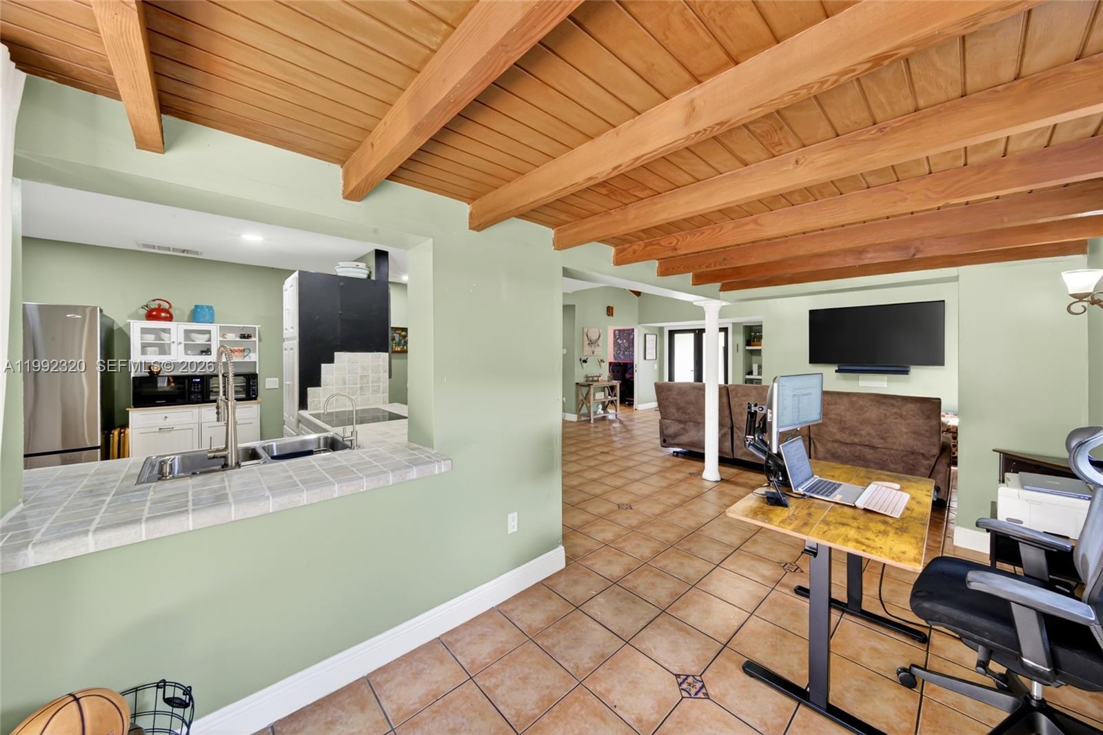 10861 Southwest 132nd Cir Court Miami, FL 33186 - Photo 23 of 42 a living room with furniture and a flat screen tv