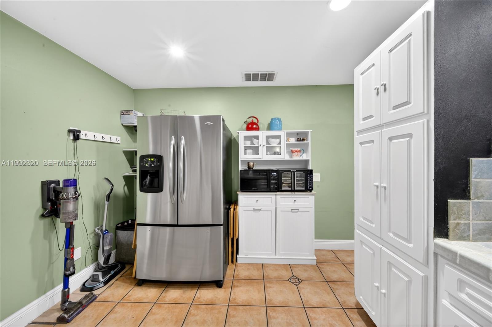 10861 Southwest 132nd Cir Court Miami, FL 33186 - Photo 28 of 42 a refrigerator freezer sitting inside of a kitchen