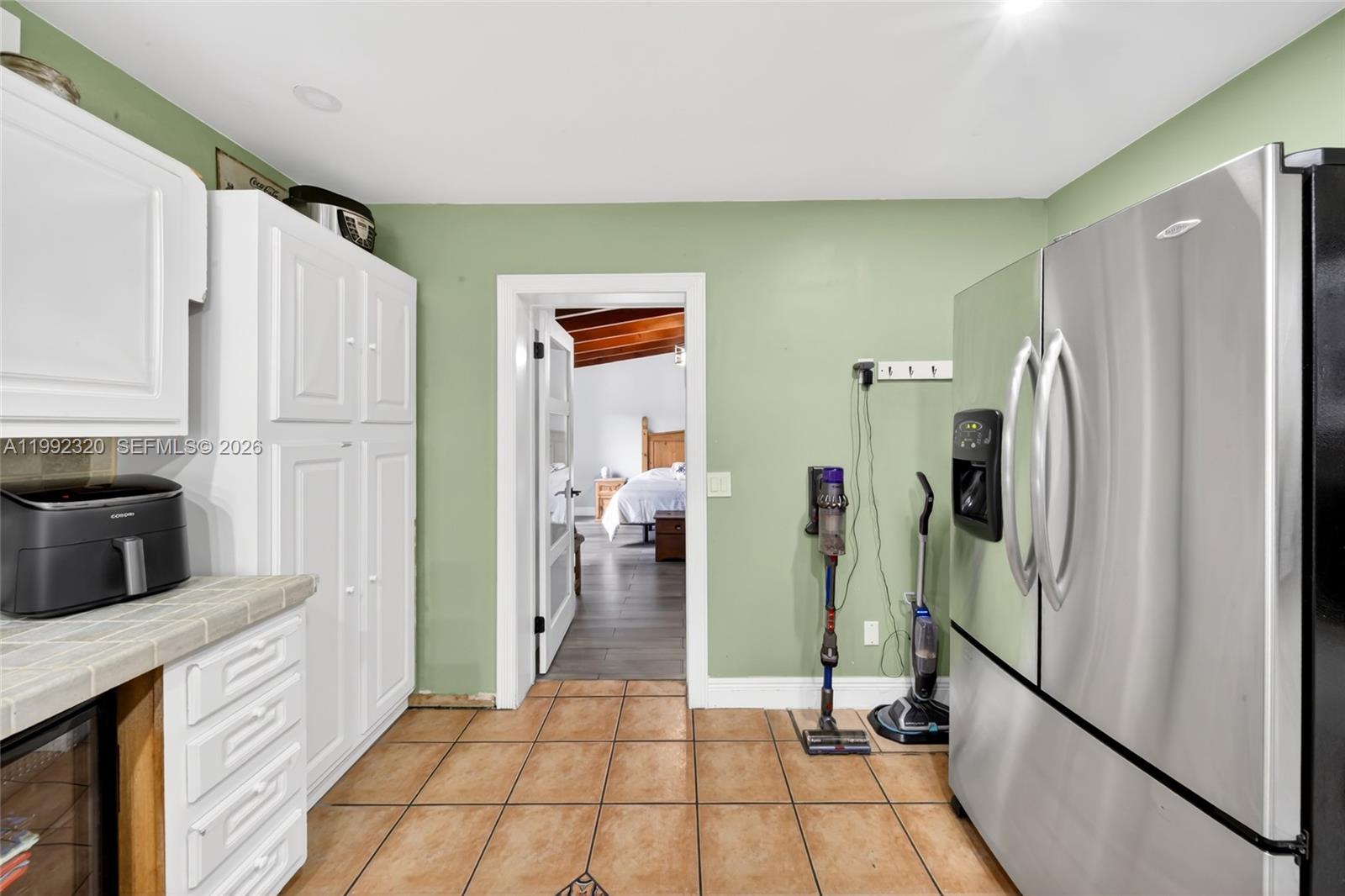 10861 Southwest 132nd Cir Court Miami, FL 33186 - Photo 29 of 42 a kitchen with a refrigerator and a sink