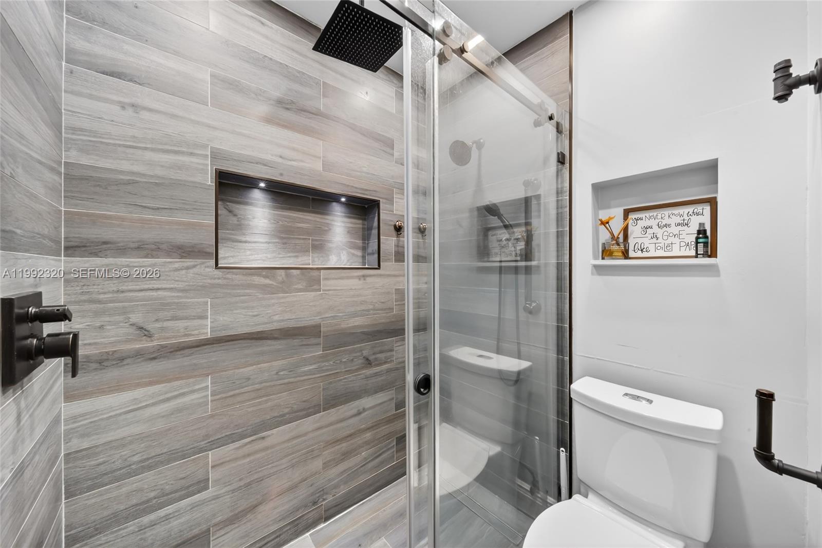 10861 Southwest 132nd Cir Court Miami, FL 33186 - Photo 33 of 42 a bathroom with a toilet and a shower