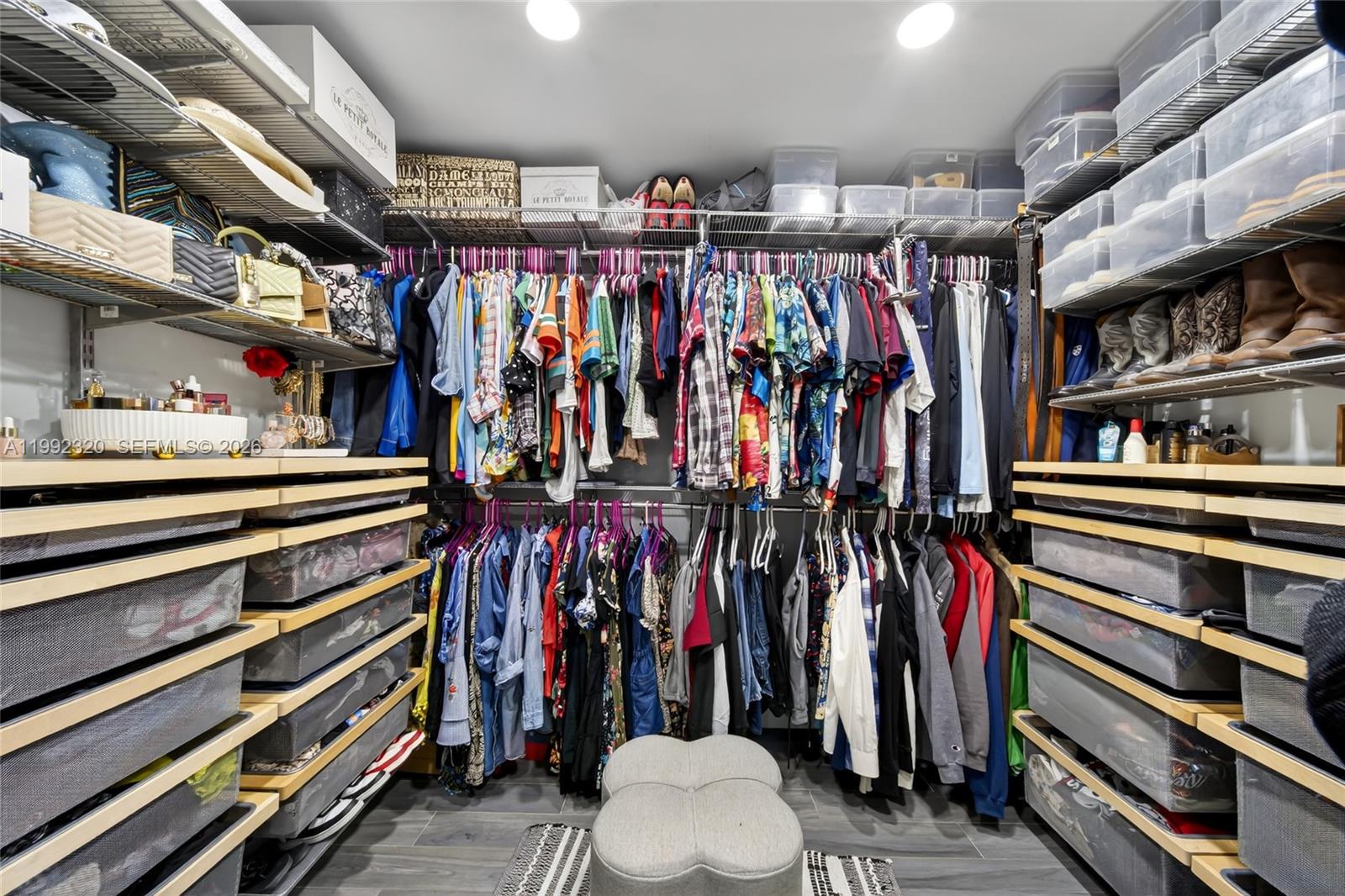 10861 Southwest 132nd Cir Court Miami, FL 33186 - Photo 35 of 42 a view of walk in closet with clothes and shoes