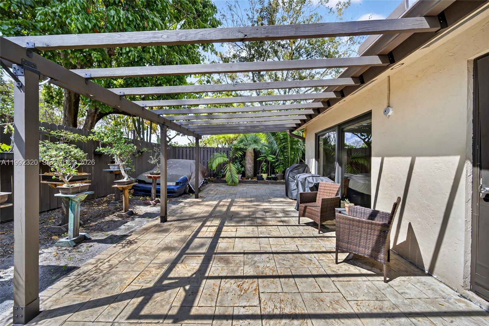 10861 Southwest 132nd Cir Court Miami, FL 33186 - Photo 36 of 42 a view of a patio with table and chairs barbeque with wooden floor and outdoor seating